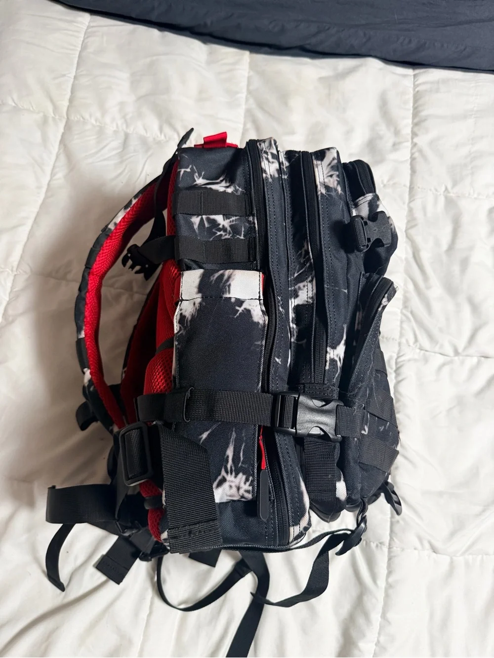 WOLF Black Backpack with Red Accents and White Marble Print